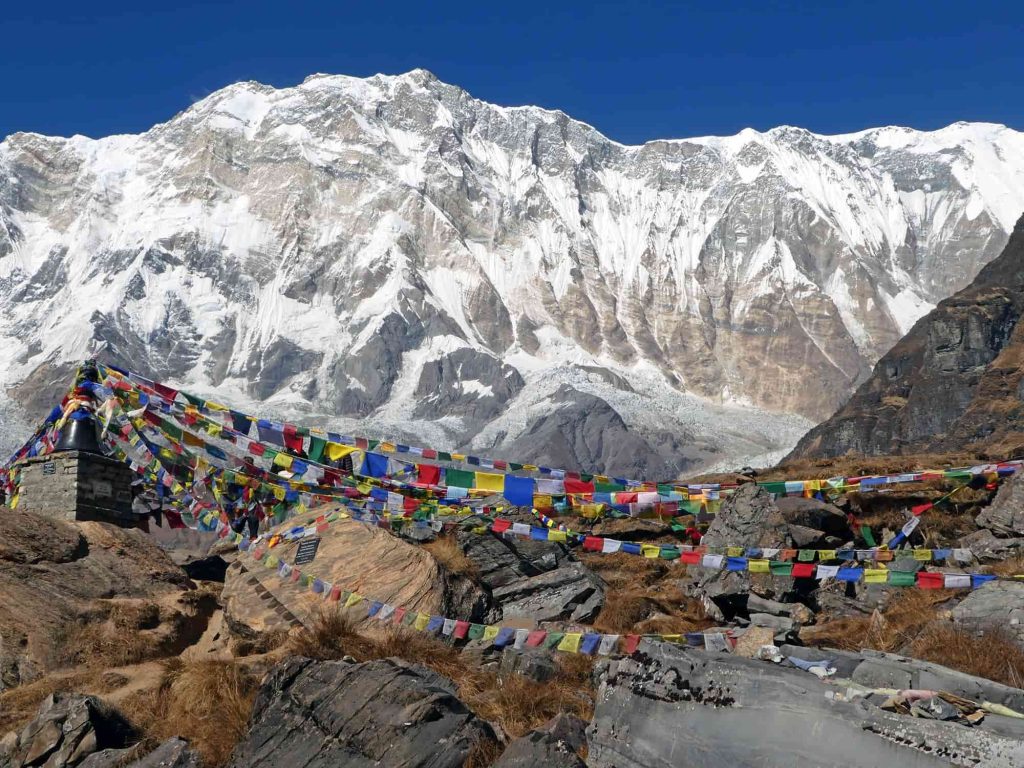 "Breathtaking view of the Annapurna mountain range on the trek to Annapurna Base Camp, showcasing snow-capped peaks, lush valleys, and the stunning natural beauty of the Himalayas."